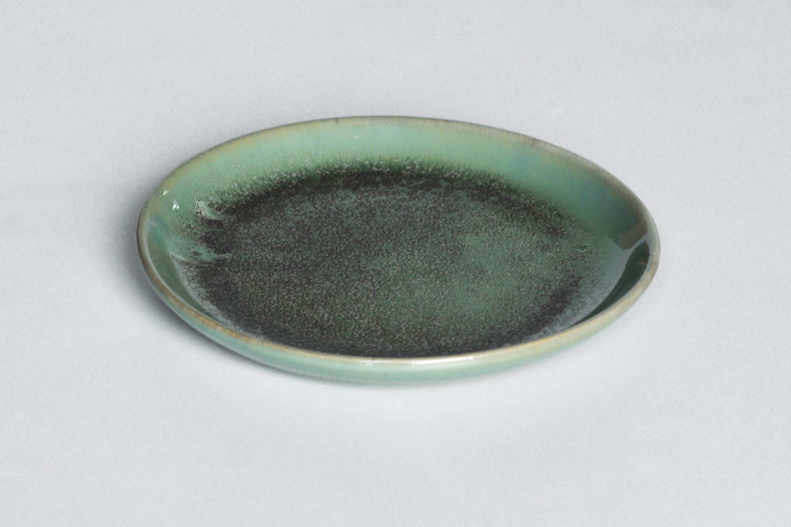 AER Dinner Plate — sage glaze stoneware, styled